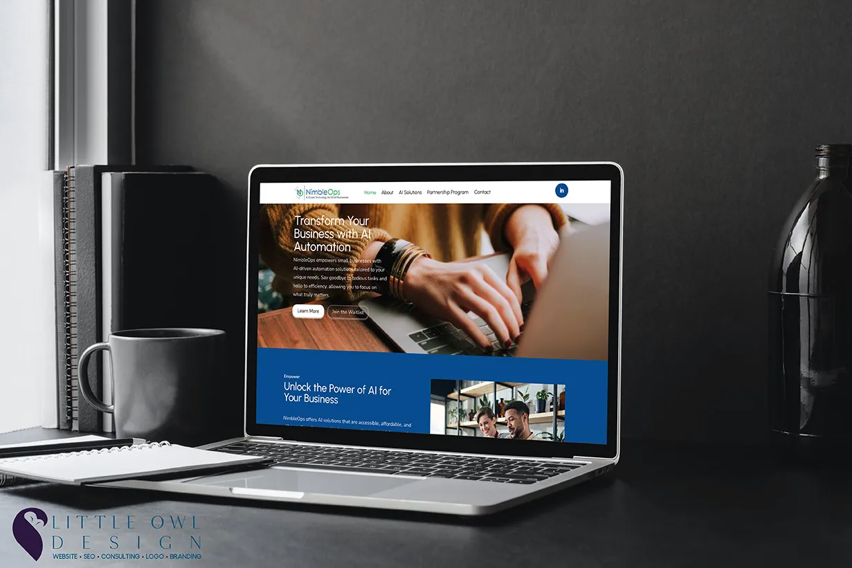 Laptop displaying a business website with hands typing on a keyboard.